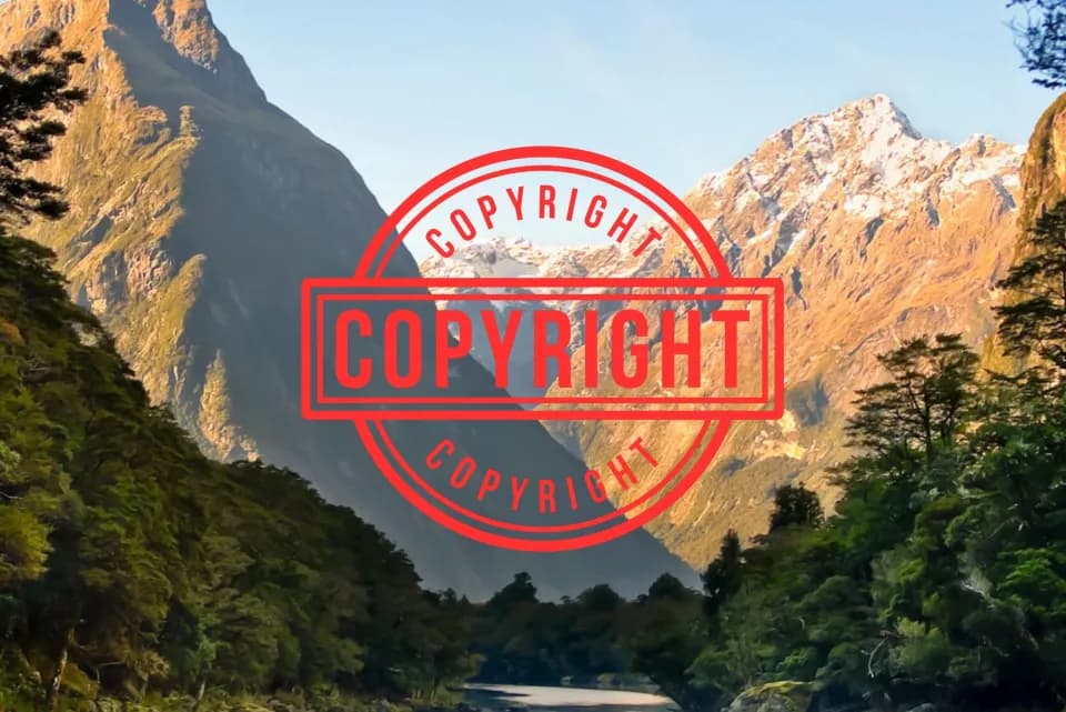 A mountain valley photograph stamped with a large red COPYRIGHT seal